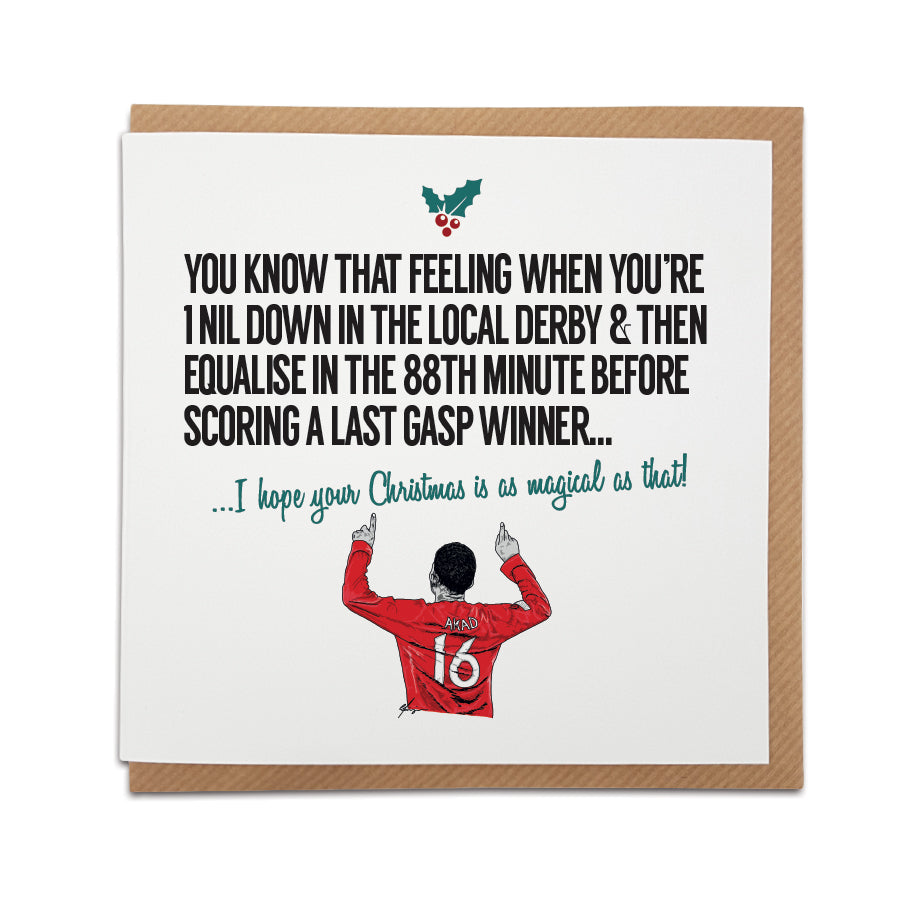 Greeting card by Local Lingo featuring a festive hand-drawn illustration of Amad Diallo celebrating his winning goal in the Manchester derby, with the text "I hope your Christmas is as magical as that!", designed on high-quality card stock.