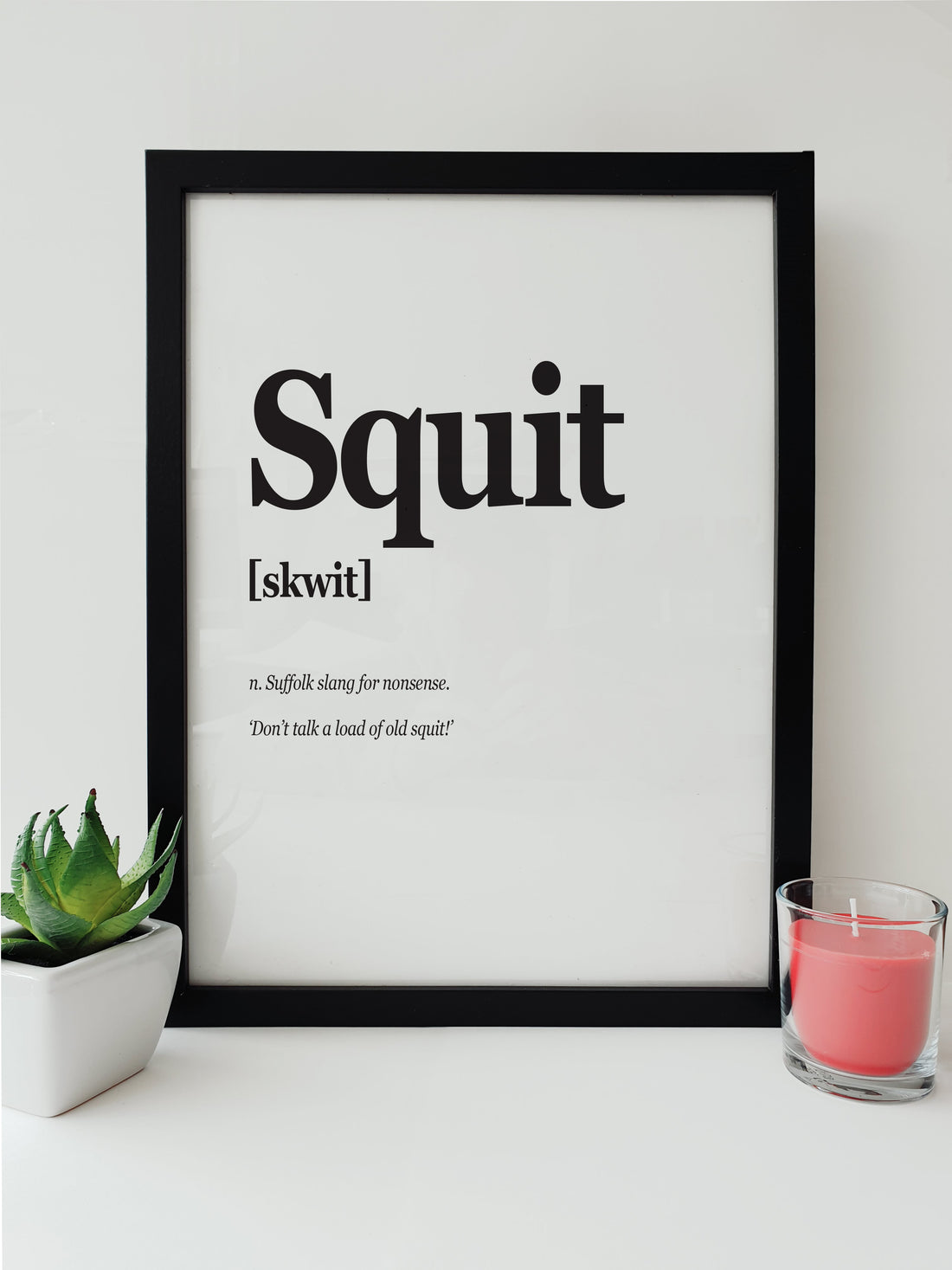 Art print illustrating the Suffolk slang 'Squit', meaning nonsense, complemented by the humorous phrase 'Don’t talk a load of old squit!' in a clear, bold, black and white design. designed by local lingo