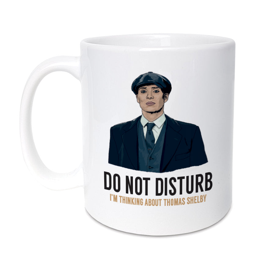 A unique mug featuring hand drawn illustration of Tommy Shelby from Peaky Blinders. Enjoy a cup of tea or coffee & sit back, relax & think about Thomas Shelby.  Mug reads:   Do not disturb I'm thinking about Thomas Shelby