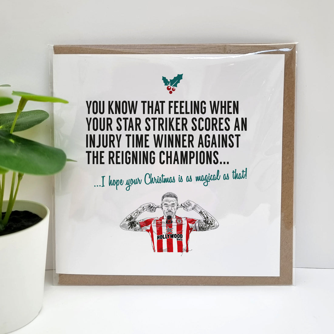 A handmade Brentford Football fan Christmas Card celebrating the win over Man City on 12 November 22. Perfect for Brentford fans. Featuring hand drawn illustration of Ivan Toney.  Card reads: You know that feeling when your tart striker scores an injury time winner against the reigning champions... I hope your Christmas is as magical as that!